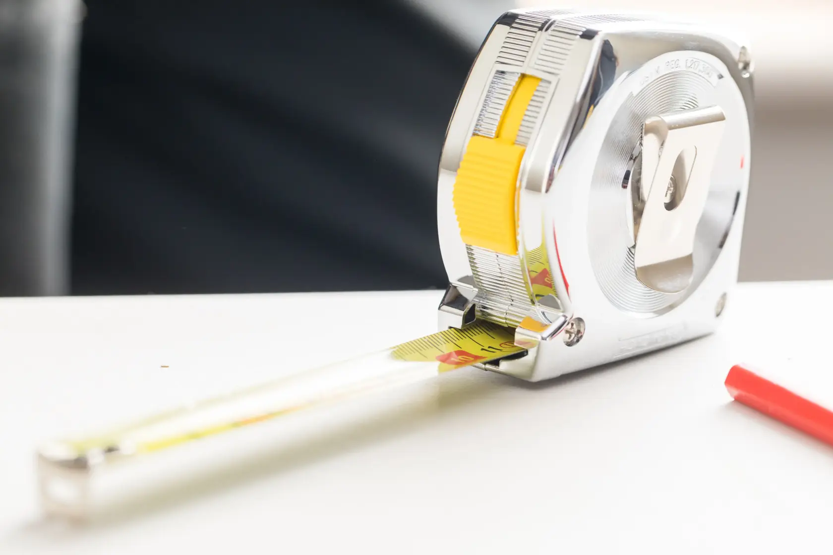 Photo of STANLEY 0-33-194 PowerLock 5m tape measure, chrome case, yellow blade, front angle on white background.