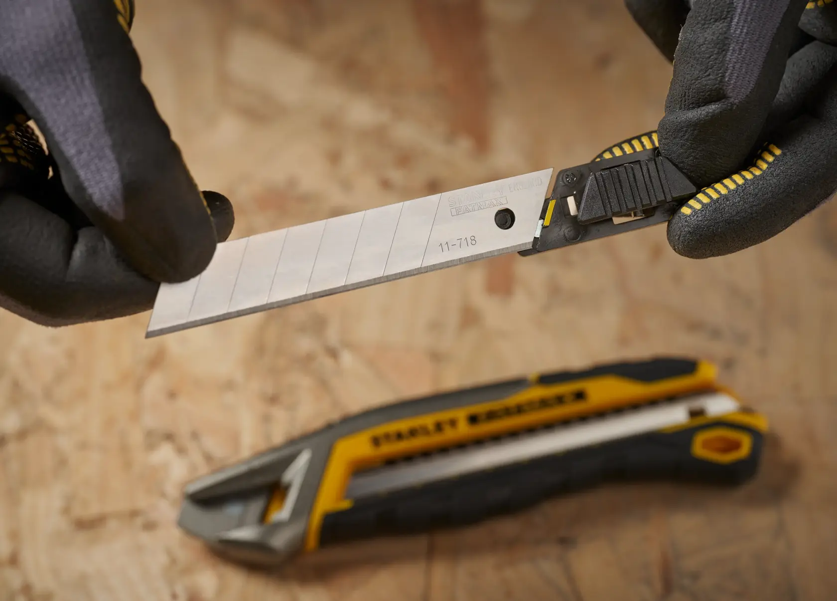STANLEY 3-11-718 utility knife blades, photography, side angle, ten packs of silver segmented blades.