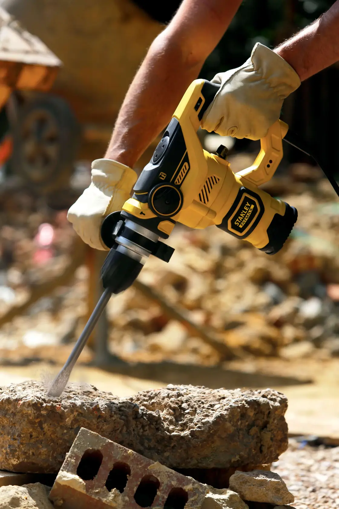 Stanley yellow rotary hammer drill with black carrying case.