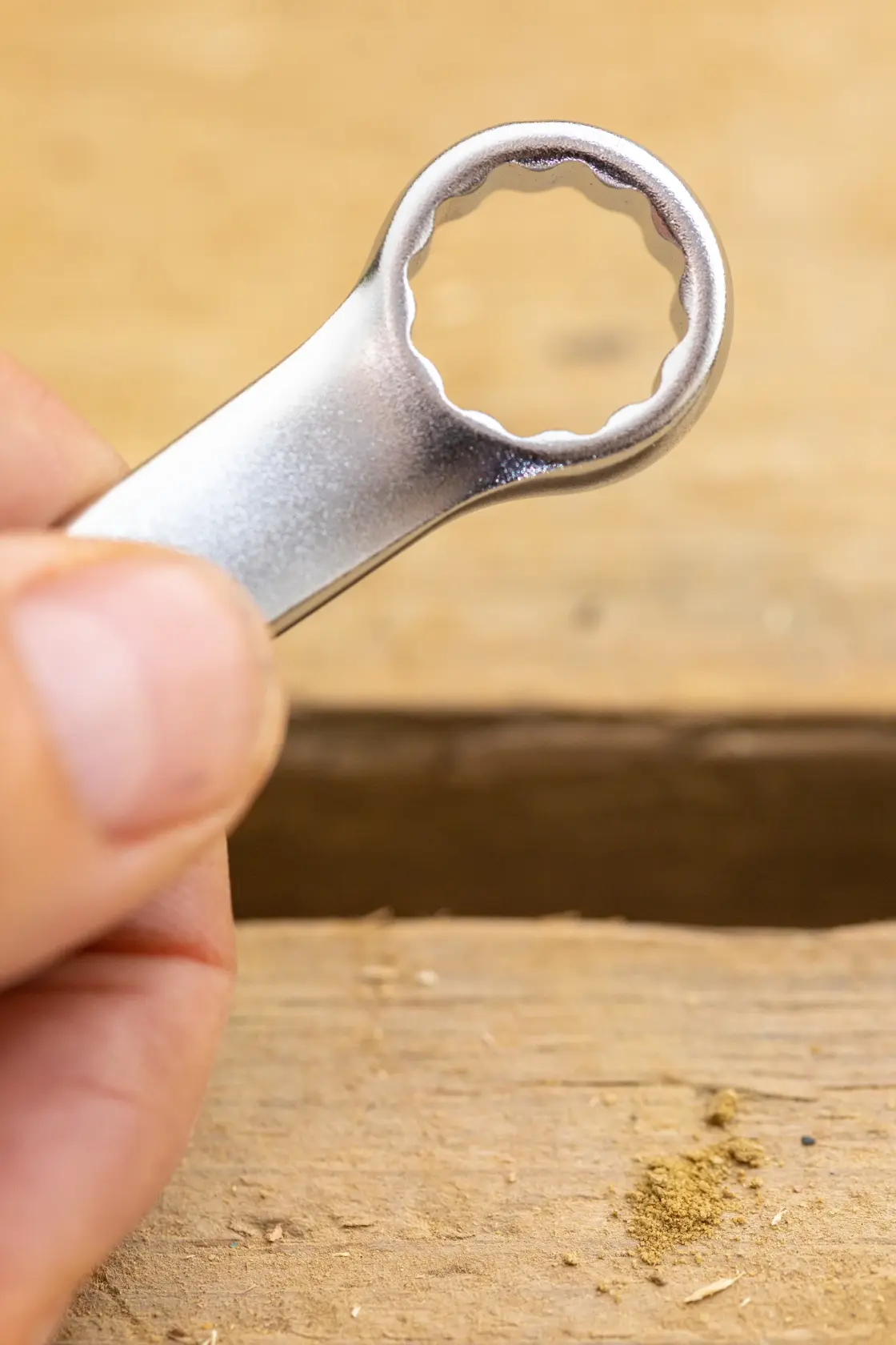 STANLEY FMMT13036-0 close-up photo of silver box-end wrench held against wooden surface.