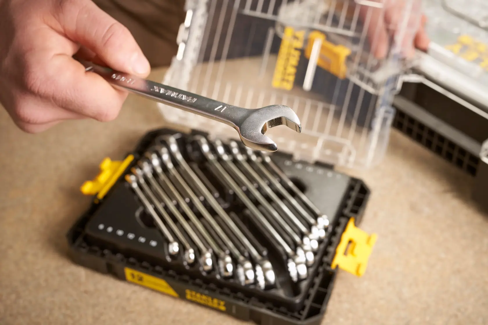 STANLEY FMMT98104-0 wrench set with multiple wrenches in black and yellow case, close-up view.