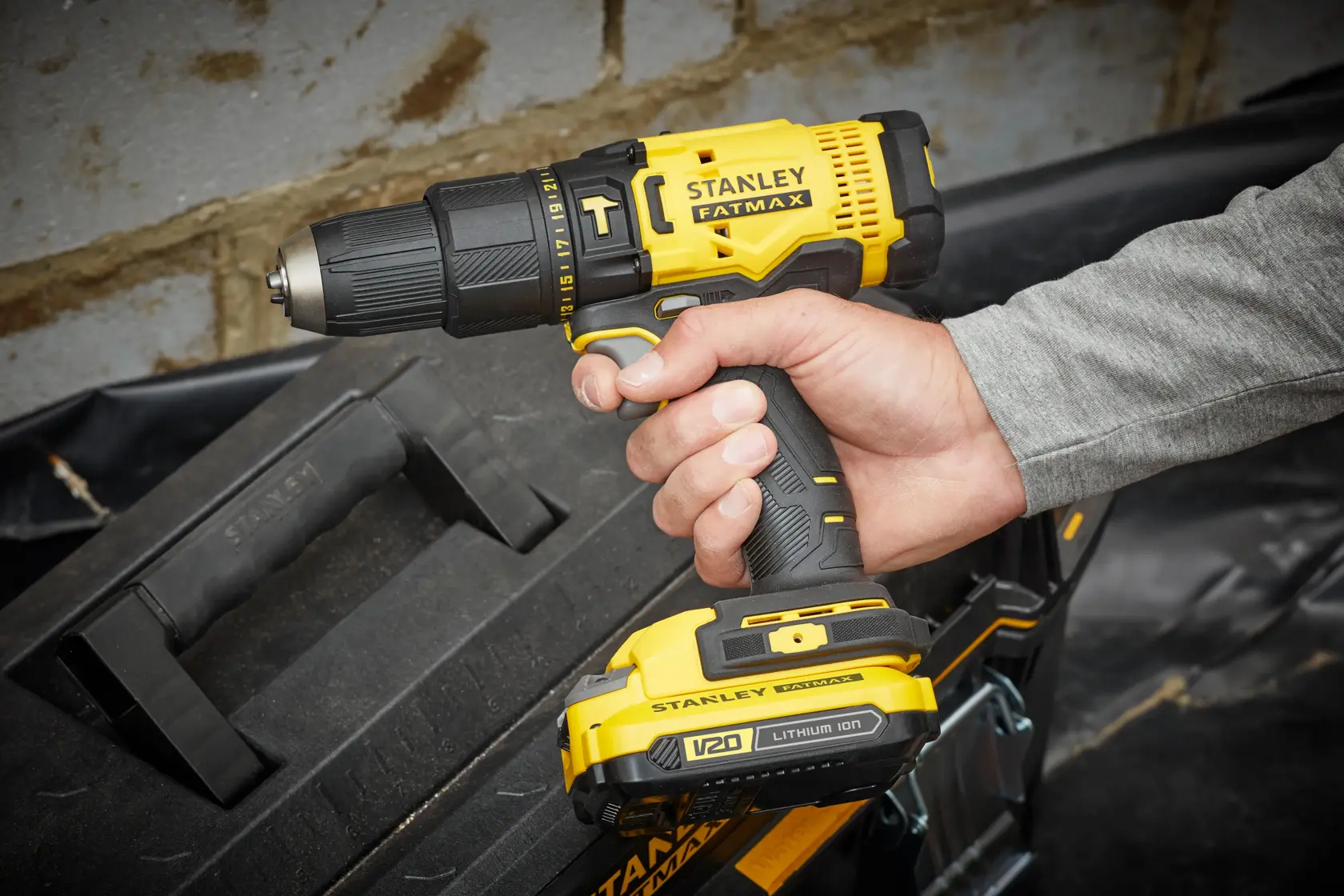 STANLEY SFMCD711C2K cordless drill with yellow and black design, FATMAX branding, handheld side angle.