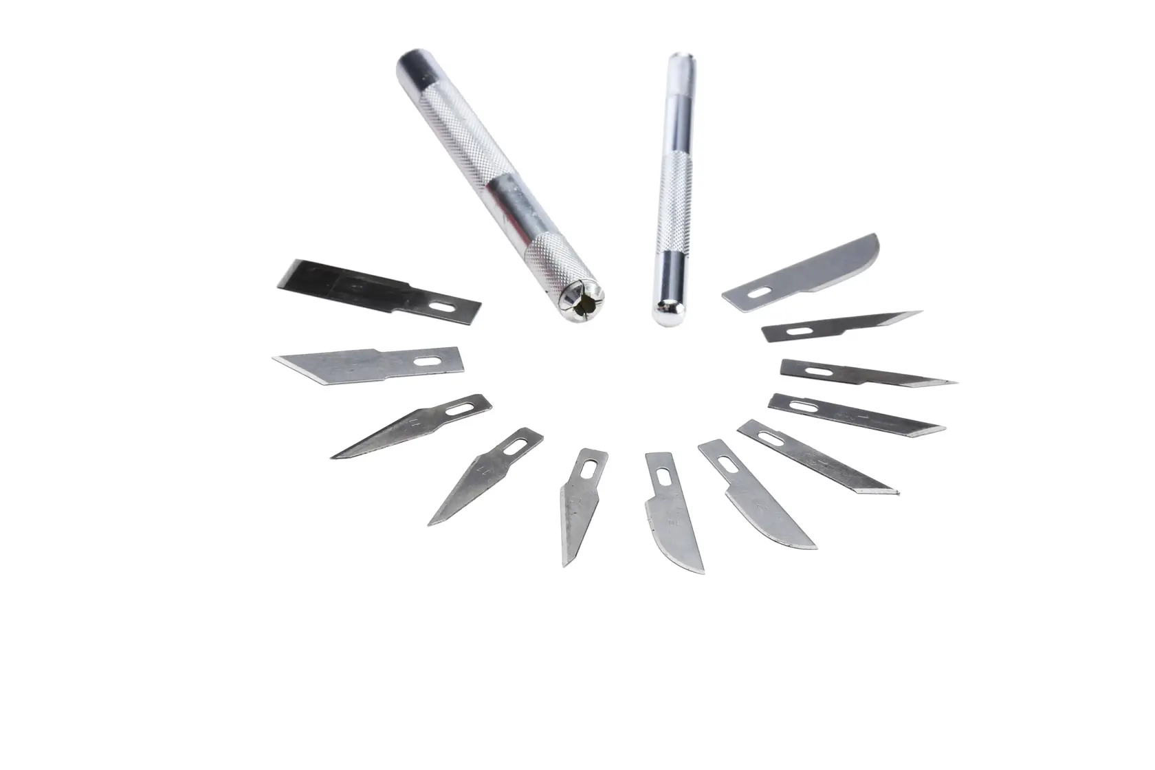 Two precision knives and assorted replacement blades arranged in a semicircle on a white background.